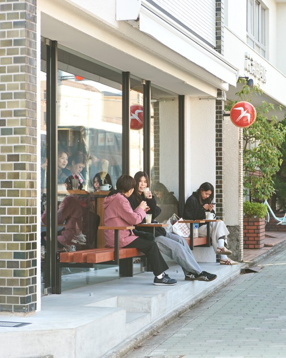 Customers sitting in front of Fuglen