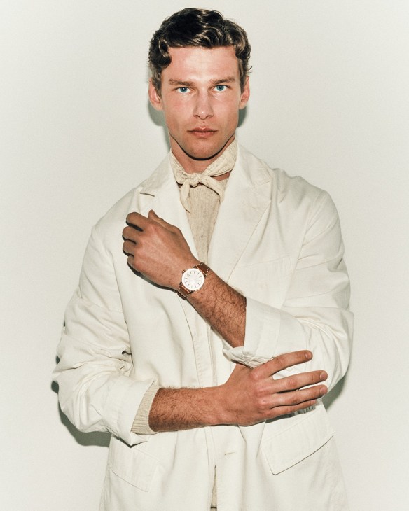 Model wearing a jacket by Ferragamo, jumper by The Workers Club, handkerchief by Berluti, code 11.59 