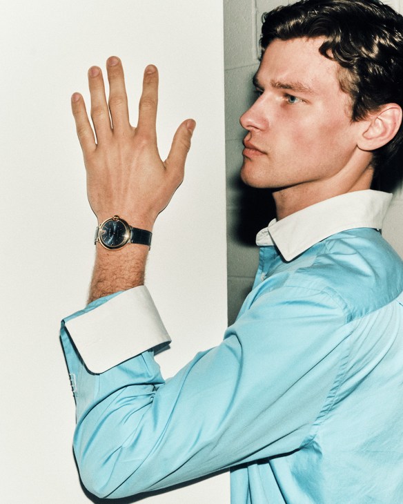 Model wearing Shirt by JW Anderson, Ballon Cleu de Cartier watch by Cartier