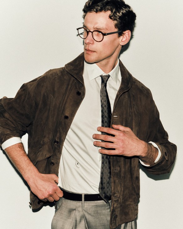 Model wearing jacket by Auralee, shirt and tie by Berluti, trousers by Canali, glasses by Lindberg, belt by Anderson’s from Trunk