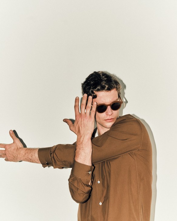 Model wearing shirt by Hermès, t-shirt by Calida, sunglasses by Dunhill