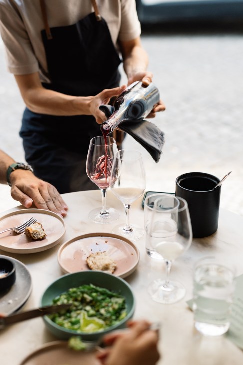 Person pouring wine in Portugal