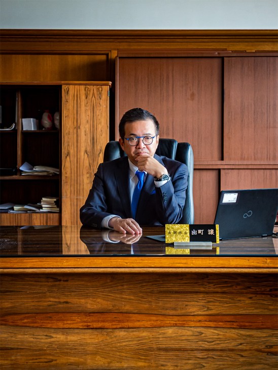Mayor of Takaoka, Yuzuru Demachi in his office