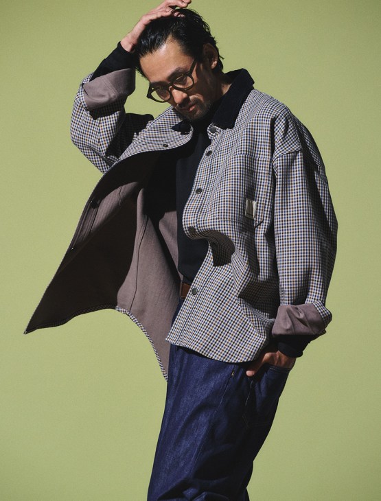 Model wearing jacket and jeans by Emporio Armani, T-shirt by Beams F, glasses by Mykita, belt by J.M. Weston