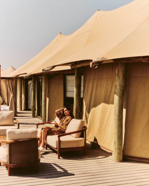 Person relaxing outside at a Sharjah Collection Hotel