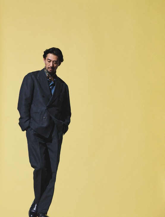 Model wearing Jacket, shirt and trousers by Beams F, boots by J.M. Weston, scarf by Brilla Per Il Gusto