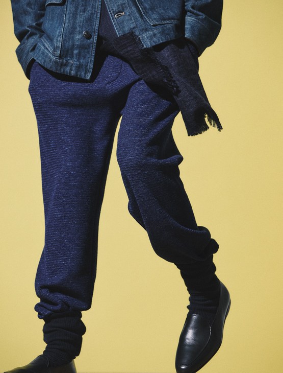 Model wearing Jacket, trousers, socks, shoes and scarf by Loro Piana