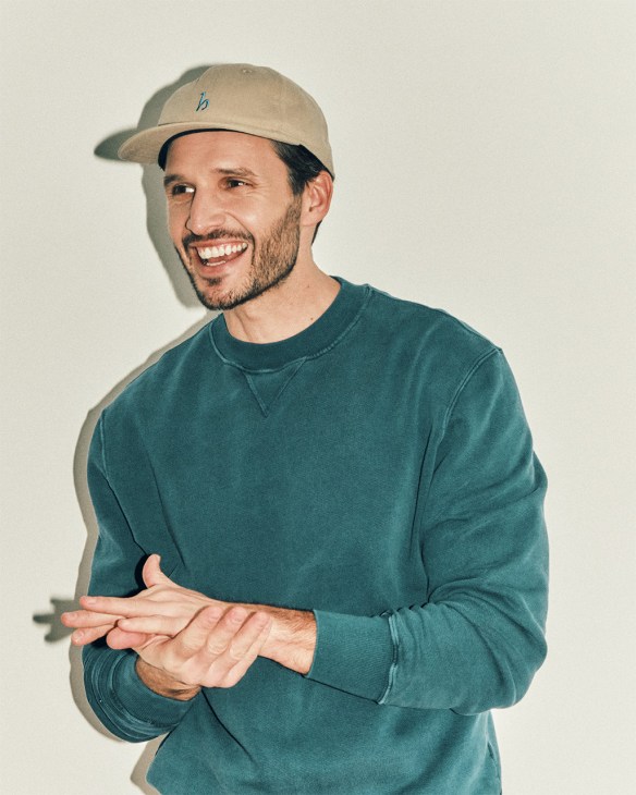 Model wearing jumper and cap from Hanover