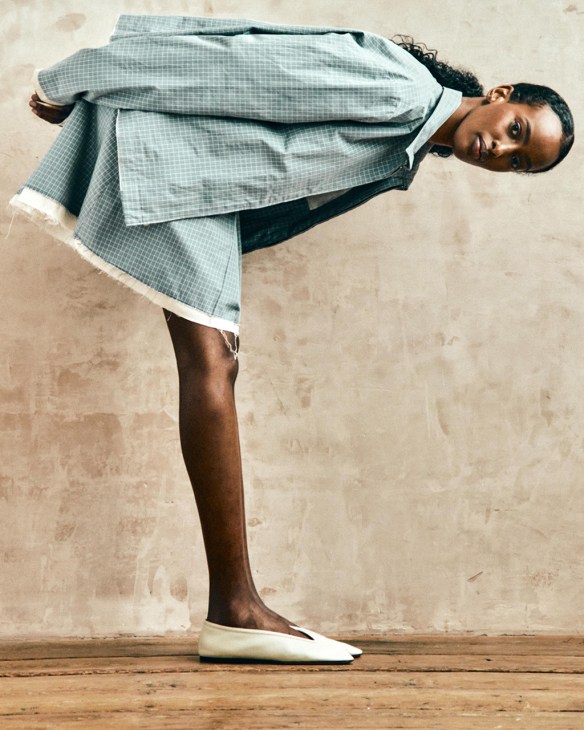 Model wearing teal checked coat from Camiel Fortgens