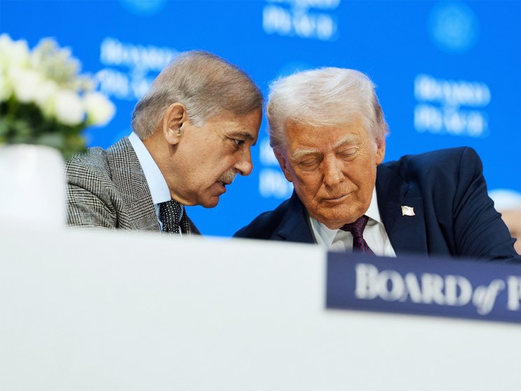 President Donald Trump, right, speaks with Mian Muhammad Shehbaz Sharif, Prime Minister of Pakistan, during a signing of the Board of Peace charter during the Annual Meeting of the World Economic Forum in Davos, Switzerland