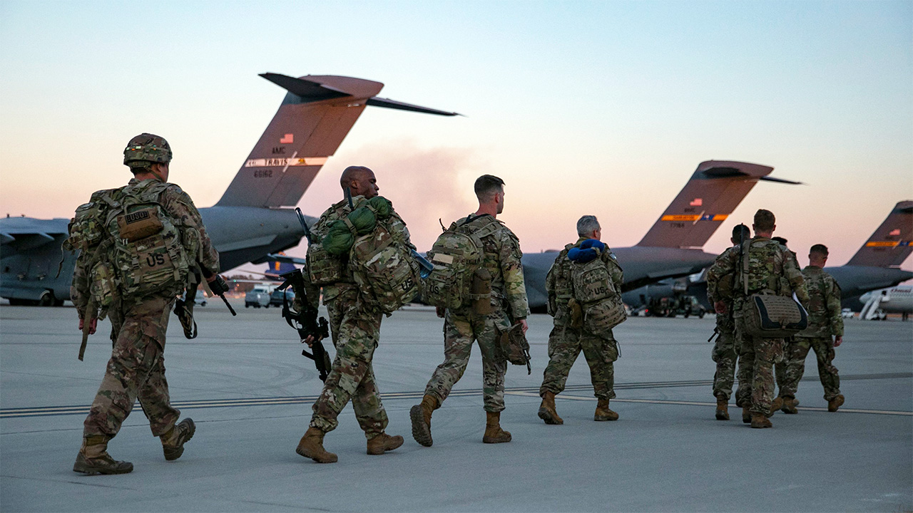 Trump says the Iran war could end in ‘two to three weeks’ despite US troop build-up