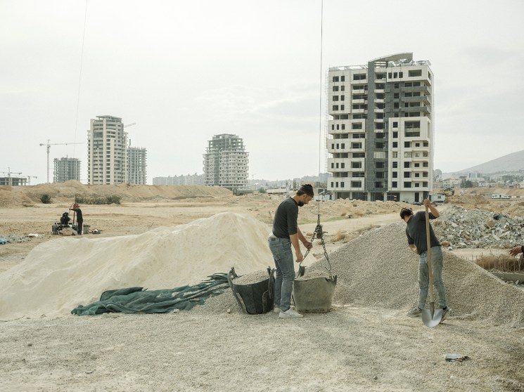 Workers rebuilding the streets of Syria