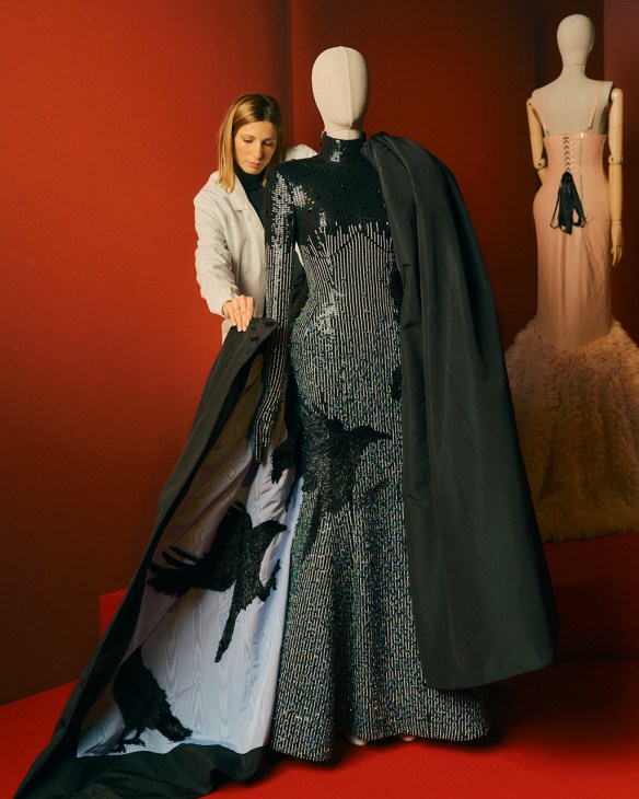 Woman working on a display for the 'Exposure – The Power of Being Seen’ exhibition