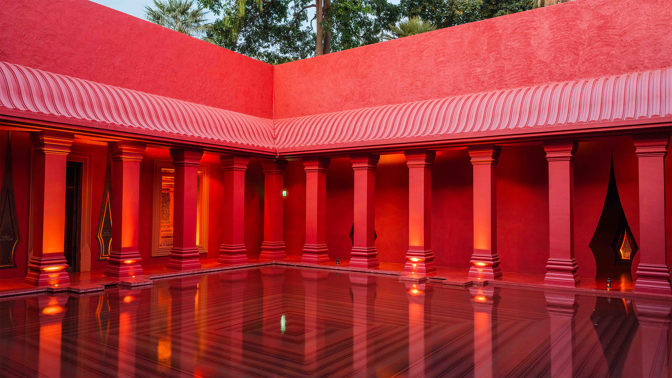 Exterior view of The Barai spa in Bangkok with a pool and architectural elements
