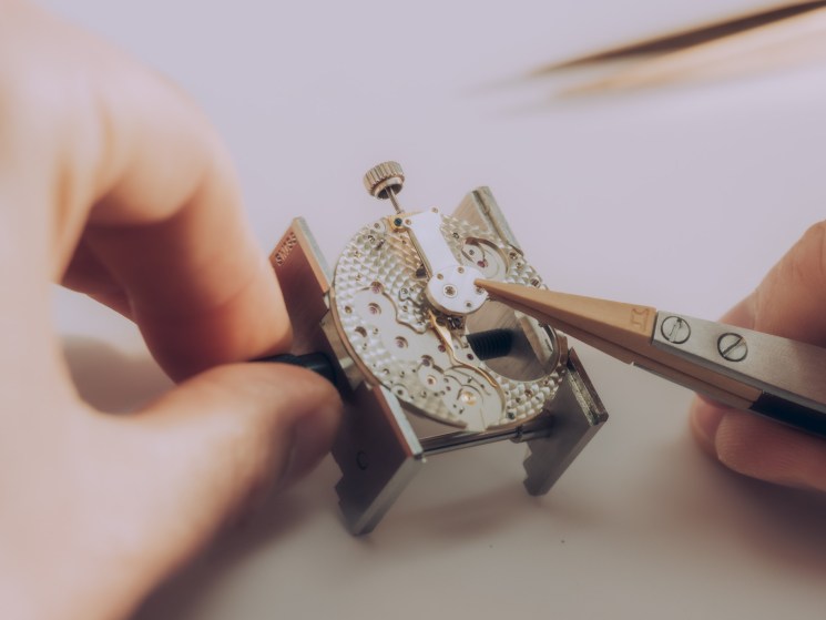 Crown wheel and winding pinions being fitted to a Lange 1 by A Lange & Söhne