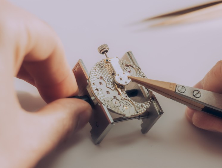 Crown wheel and winding pinions being fitted to a Lange 1 by A Lange & Söhne