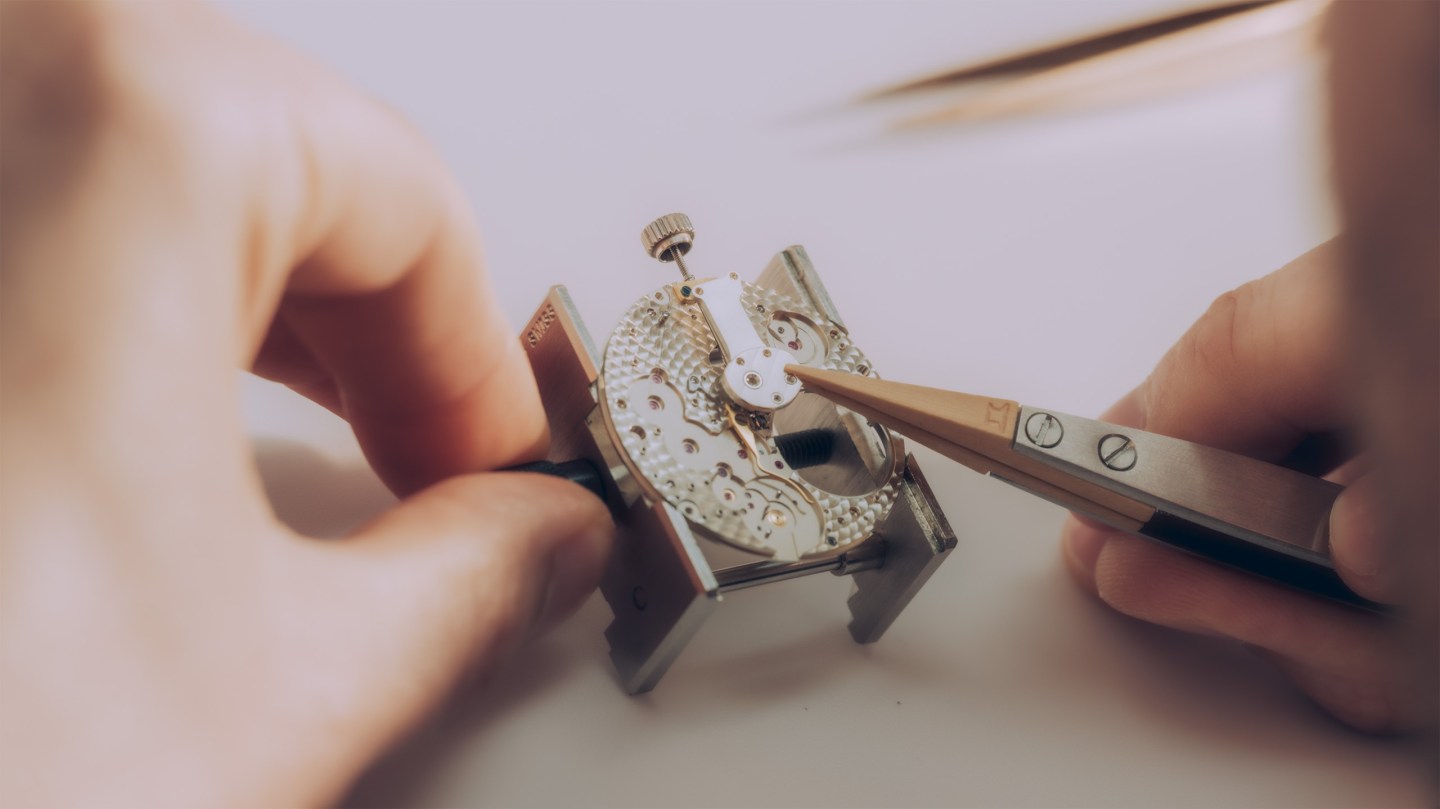 Crown wheel and winding pinions being fitted to a Lange 1 by A Lange & Söhne