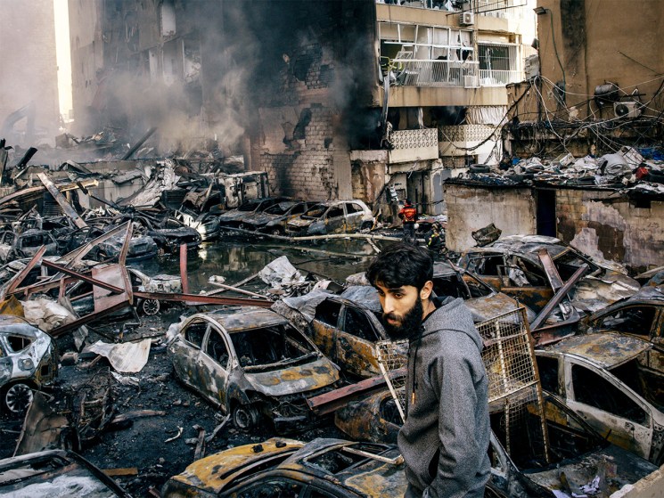 A man in Lebanon looks on following an Israeli strike on Beirut