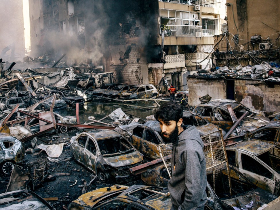 A man in Lebanon looks on following an Israeli strike on Beirut