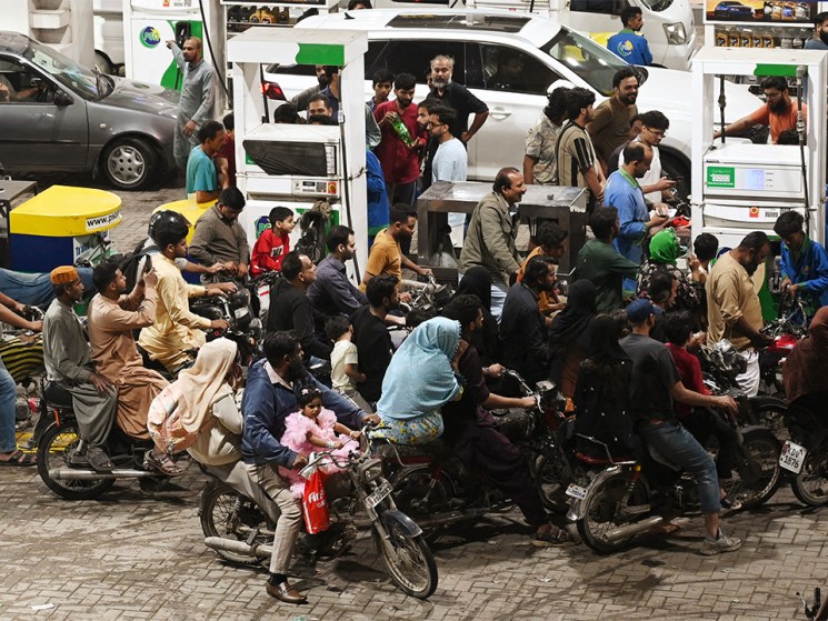 Clients queue at a gas station amid rising petrol prices in Karachi on April 3, 2026. US-Israel war on Iran, launched on February 28, has roiled global energy and equities markets, sending oil prices skyrocketing after Tehran virtually closed the key Strait of Hormuz.