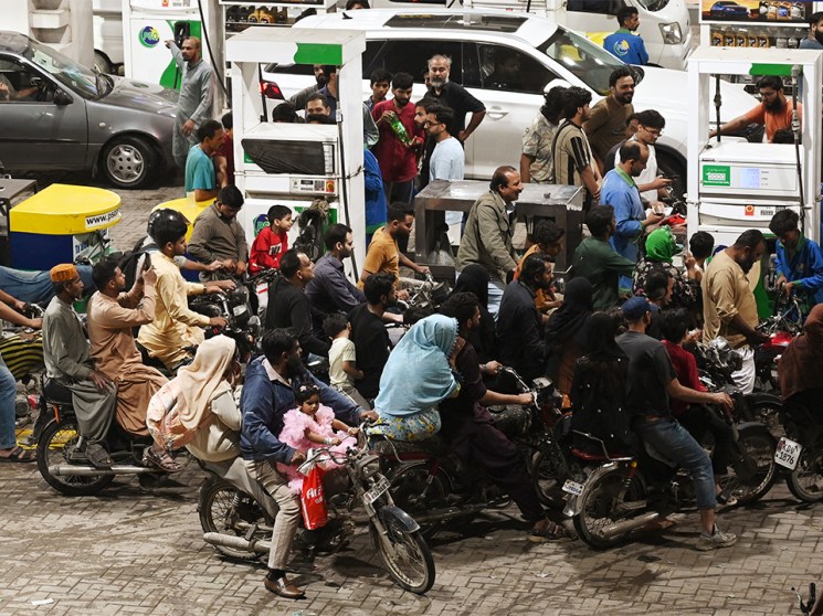Clients queue at a gas station amid rising petrol prices in Karachi on April 3, 2026. US-Israel war on Iran, launched on February 28, has roiled global energy and equities markets, sending oil prices skyrocketing after Tehran virtually closed the key Strait of Hormuz.