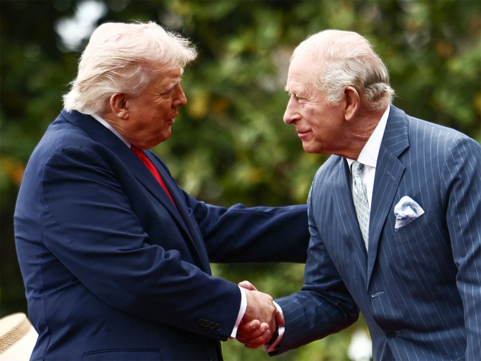 US President Donald Trump and Britain's King Charles III shake hands during an arrival ceremony on the South Lawn of the White House in Washington