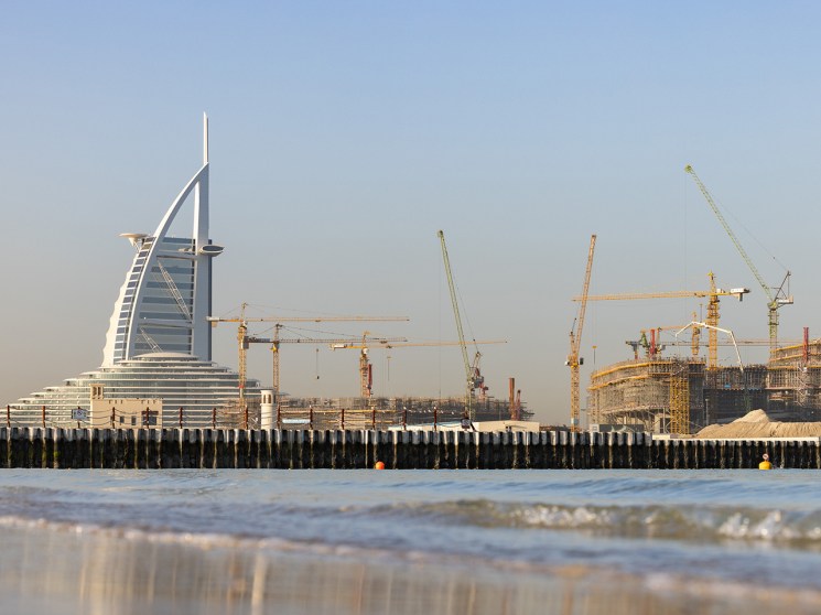 Construction cranes near the Burj Al Arab Hotel in Dubai, United Arab Emirates, on Friday, Feb. 20, 2026. Dubai developers see the luxury property boom continuing in 2026. Photographer: Walaa Alshaer/Bloomberg via Getty Images