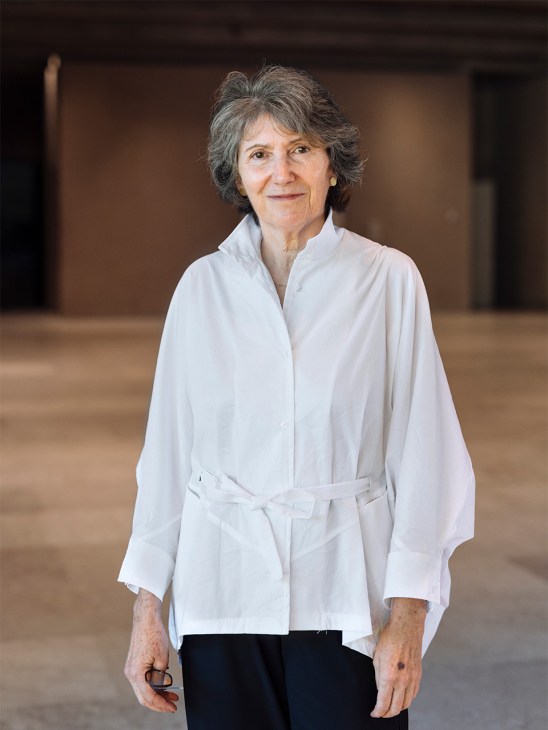 Teresa Nunes da Ponte, lead architect of the Gulbenkian Museum renovation, stands in a white shirt in the museum's interior space.