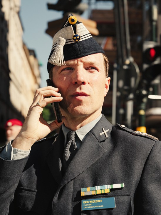 Lieutenant Erik Widegren in Swedish Army uniform answers a phone call.
