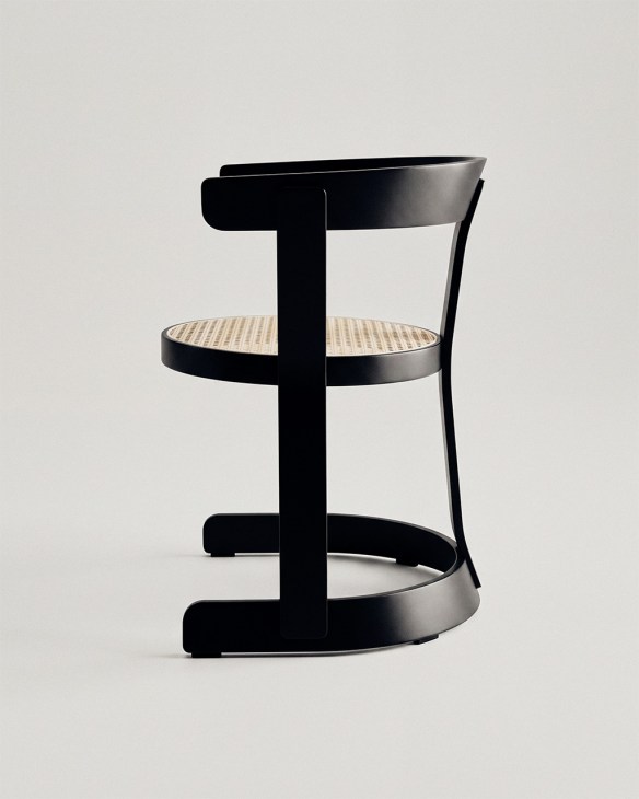Black wooden Klepsydra children's chair with caned seat designed by Teresa Kruszewska in the 1960s, reissued by 366 Concept.