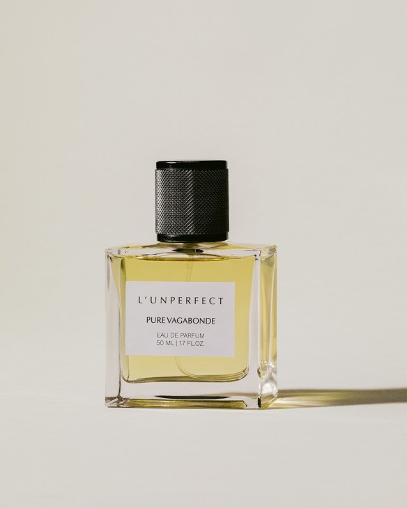 L'Unperfect Pure Vagabonde eau de parfum bottle with pale yellow liquid and black textured cap.