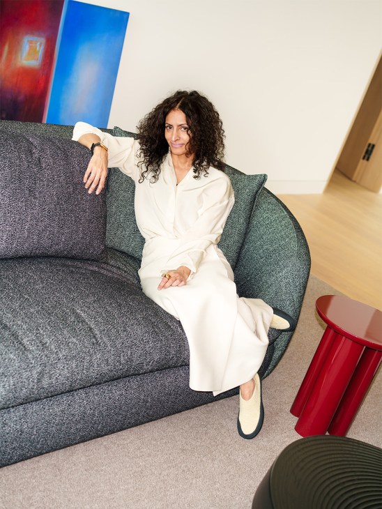 Neelam Ahooja relaxing on a sofa