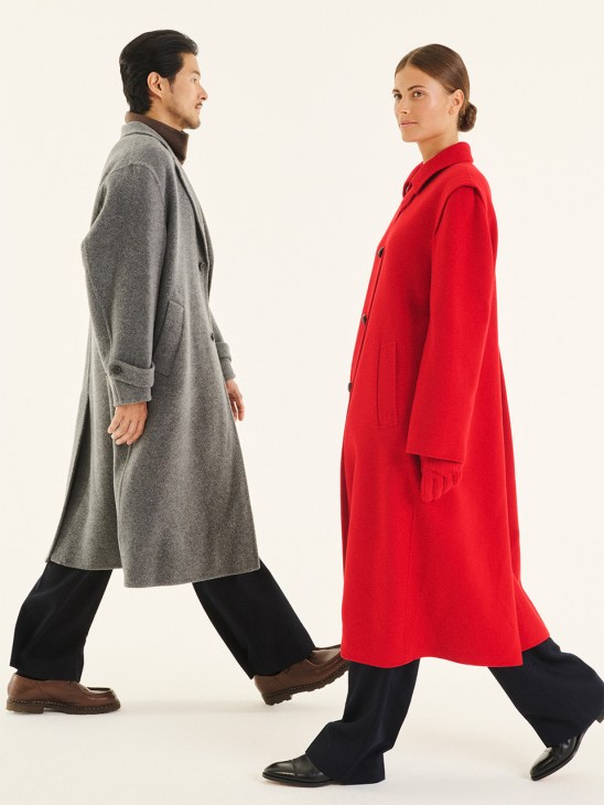 Man in gray wool coat and woman in red wool coat walking, wearing Paraboot and John Lobb shoes.