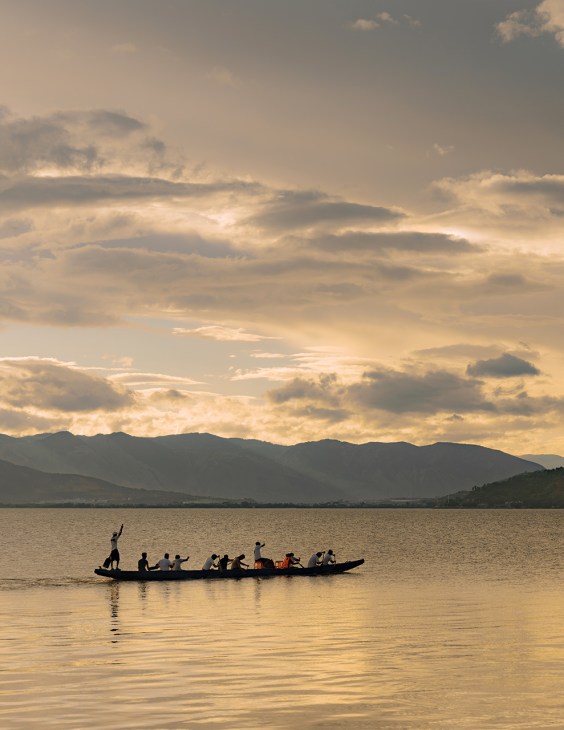 Paddlers on a dragon boat on the Erhai lake