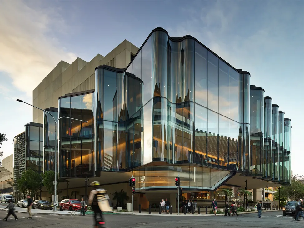 Glasshouse Theatre in Brisbane features an undulating glass façade with curved architectural elements and ground-level public entrance.