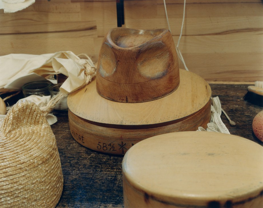 Wooden hat molds and blocks in Maison Michel's woodcarving workshop.