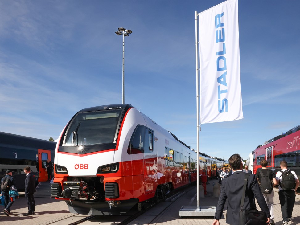 Red and white Stadler battery train for Austrian Federal Railways displayed at Innotrans trade fair.