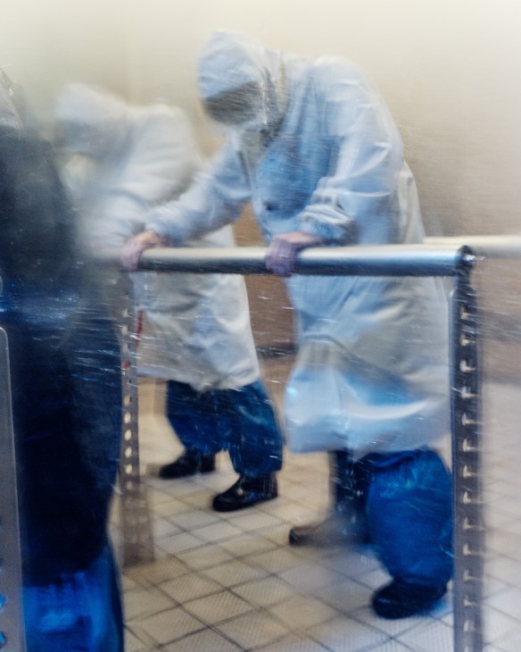 Firefighters in protective gear training in heavy rain and wind at the Honjo Life Safety Learning Centre