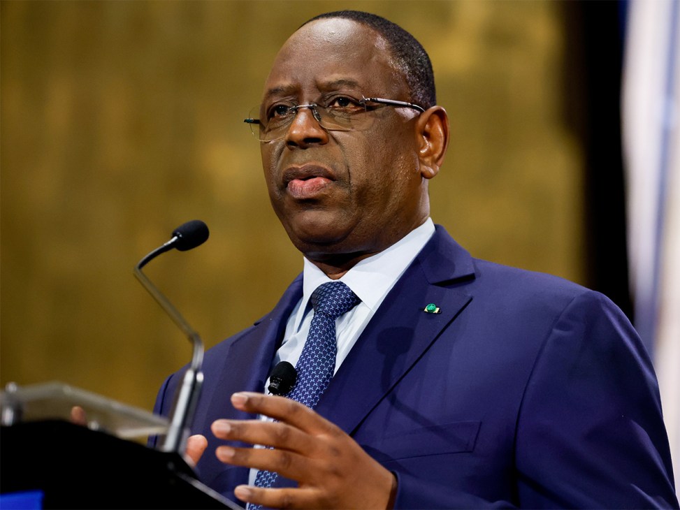 Macky Sall, president of Senegal, speaking at a podium with microphone