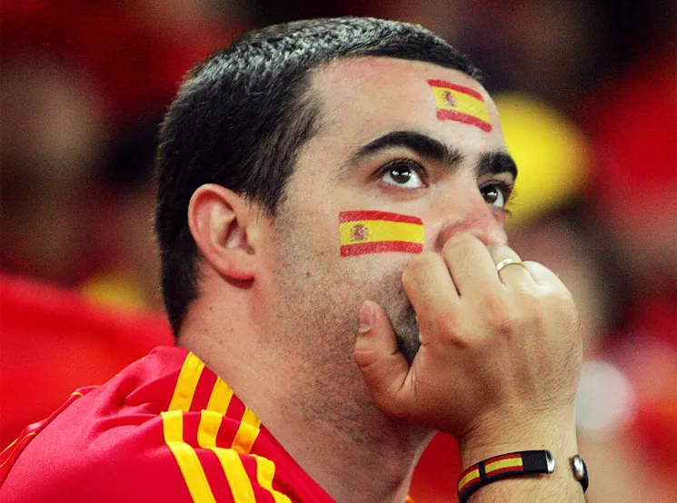 For some, today’s national holiday is a bright display of Spanish pride. For others, it’s something darker