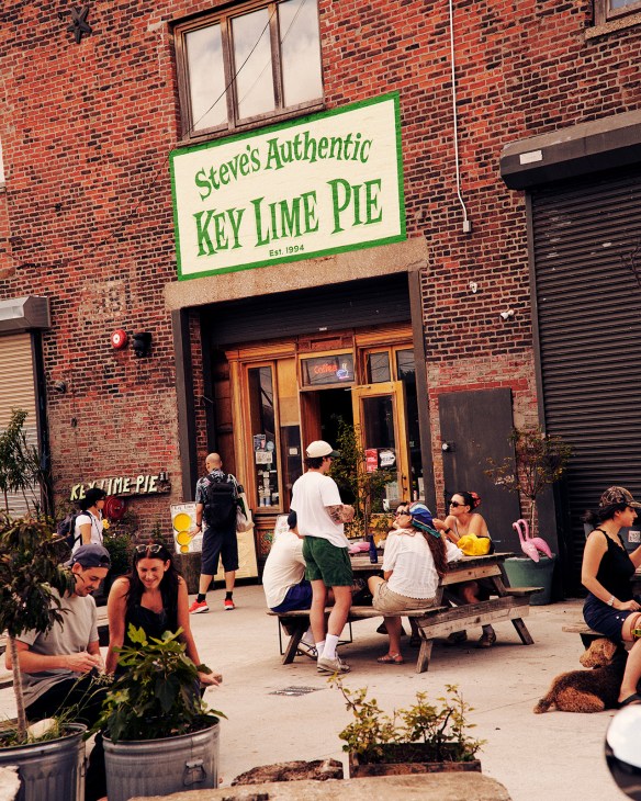 Steve's Authentic Key Lime Pie storefront with green signage on red brick building in Red Hook, Brooklyn.