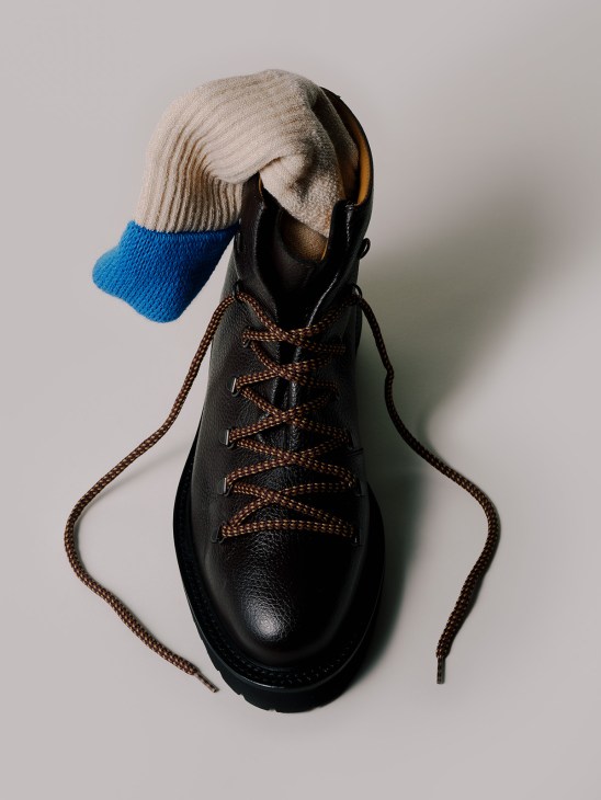 Black lace-up boot with brown laces and blue wool socks by Jacques Solovière and Ivy Ellis