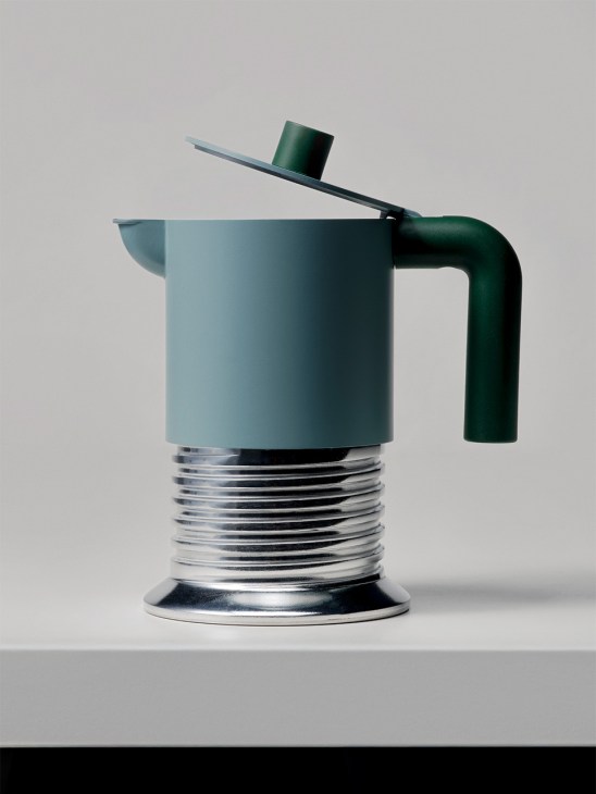 Alessi Vite moka pot with light blue cylindrical body, green handle, and threaded metal base.