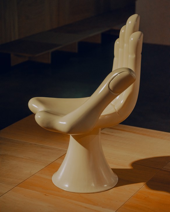 Cream-colored sculptural chair with curved organic forms by Pedro Friedeberg displayed in gallery setting.