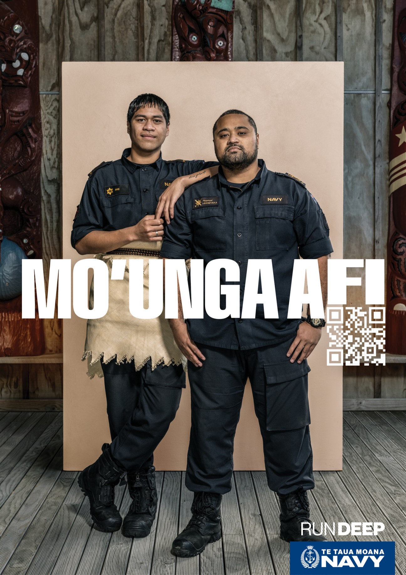 Two navy personnel in dark uniforms standing together with 'MOUNGA AFI' text and QR code overlay