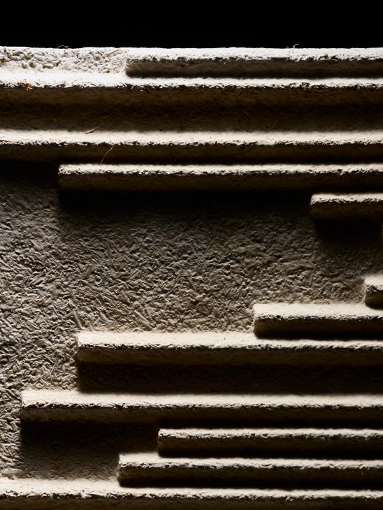 Textured acoustic panels made from hemp hurd and mushroom mycelium in stacked formation