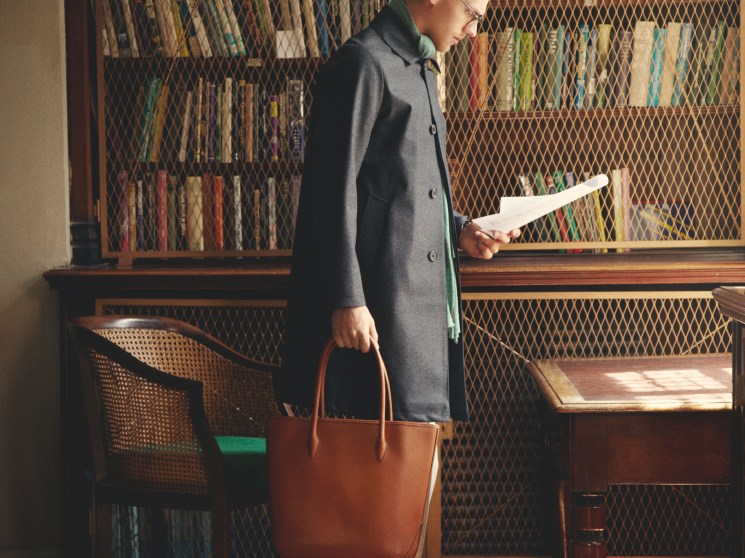 Coat by Mackintosh for Beams,scarf and trousers by Brunello Cucinelli,glasses by Oliver Peoples, shoes and bag by Visvim