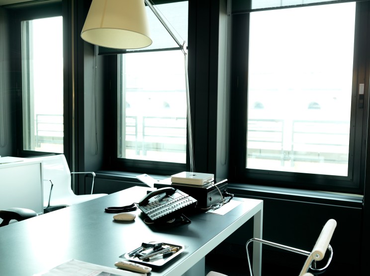 Desks are lit by Artemide Tolomeo clamp lights