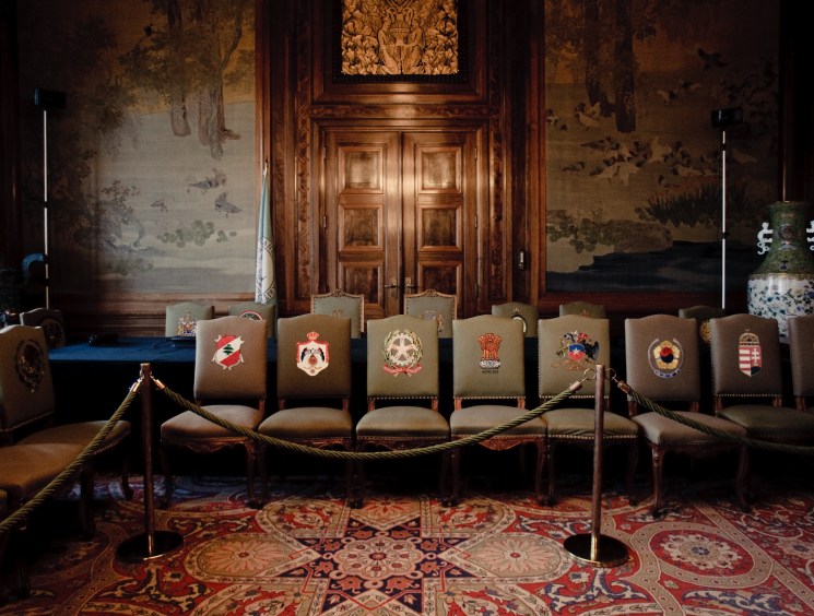 The chairs with their national symbols represent each member of the PCA