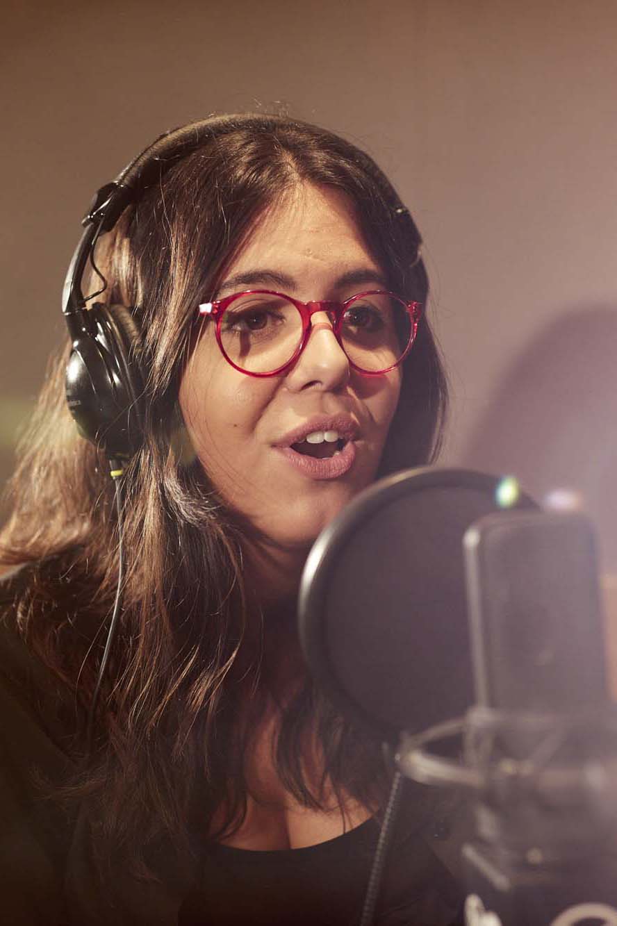 Producer and presenter Carlota Rebelo at work in the radio studio